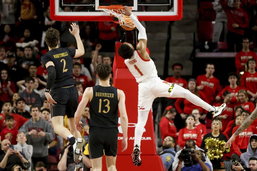 Maryland guard Jahmir Young (1) dunks the ball during the first half of an NCAA college basketball game against Northwestern, Sunday, Feb. 26, 2023, in College Park, Md. (AP Photo/Julia Nikhinson)