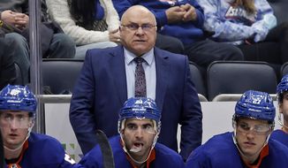 New York Islanders head coach Barry Trotz, top, looks on during the third period of an NHL hockey game against the Minnesota Wild on Jan. 30, 2022, in Elmont, N.Y. The Nashville Predators announced Sunday, Feb. 26, 2023, that Trotz is rejoining the team in their front office, succeeding David Poile, who has been the only general manager in the NHL franchise&#x27;s history. (AP Photo/Adam Hunger, File) **FILE**