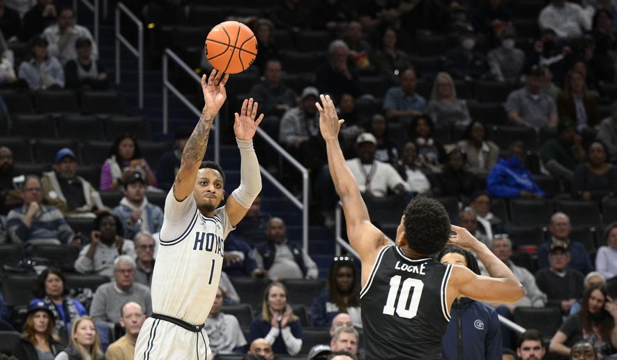 Georgetown guard Primo Spears (1) shoots against Providence guard Noah Locke (10) during the second half of an NCAA college basketball game, Sunday, Feb. 26, 2023, in Washington. Providence won 88-68. (AP Photo/Nick Wass)