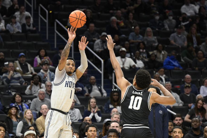 Georgetown guard Primo Spears (1) shoots against Providence guard Noah Locke (10) during the second half of an NCAA college basketball game, Sunday, Feb. 26, 2023, in Washington. Providence won 88-68. (AP Photo/Nick Wass)