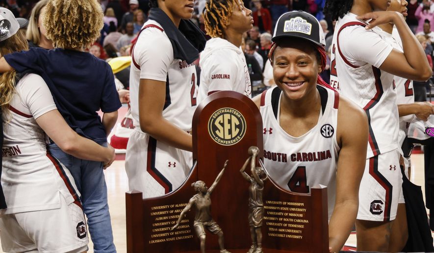 South Carolina forward Aliyah Boston stands with the SEC regular season trophy after South Carolina defeated Georgia 73-63 in an NCAA college basketball game in Columbia, S.C., Sunday, Feb. 26, 2023. (AP Photo/Nell Redmond) **FILE**