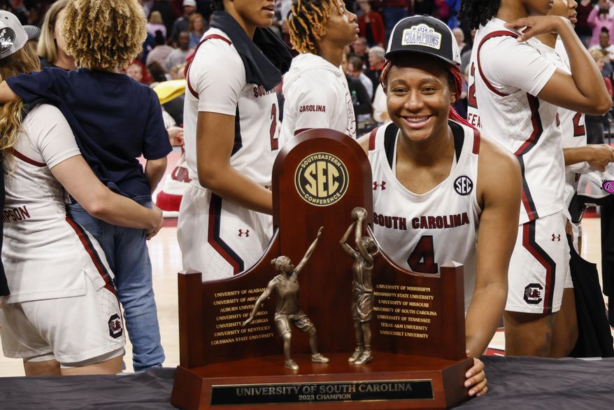 South Carolina forward Aliyah Boston stands with the SEC regular season trophy after South Carolina defeated Georgia 73-63 in an NCAA college basketball game in Columbia, S.C., Sunday, Feb. 26, 2023. (AP Photo/Nell Redmond) **FILE**
