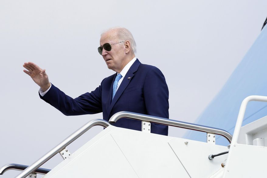 President Joe Biden waves as he boards Air Force One at Andrews Air Force Base, Md., Tuesday, Feb. 28, 2023, as he heads to Virginia Beach, Va., to talk about healthcare. (AP Photo/Susan Walsh)