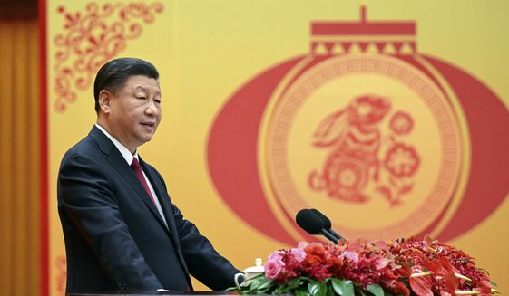 In this photo released by Xinhua News Agency, Chinese President Xi Jinping delivers a speech for a Spring Festival reception the Great Hall of the People in Beijing on Jan. 20, 2023. China has ordered closer adherence to the dictates of the ruling Communist Party and leader Xi Jinping in legal education, demanding that schools “oppose and resist Western erroneous views” such as constitutional government, separation of powers, and independence of the judiciary. (Li Xueren/Xinhua via AP) **FILE**