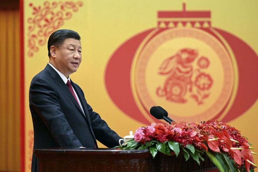 In this photo released by Xinhua News Agency, Chinese President Xi Jinping delivers a speech for a Spring Festival reception the Great Hall of the People in Beijing on Jan. 20, 2023. China has ordered closer adherence to the dictates of the ruling Communist Party and leader Xi Jinping in legal education, demanding that schools “oppose and resist Western erroneous views” such as constitutional government, separation of powers, and independence of the judiciary. (Li Xueren/Xinhua via AP) **FILE**