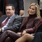 Washington Redskins owner Dan Snyder, left, and his wife Tanya Snyder, listen to head coach Ron Rivera during a news conference at the team&#x27;s NFL football training facility in Ashburn, Va., Thursday, Jan. 2, 2020. (AP Photo/Alex Brandon, File)