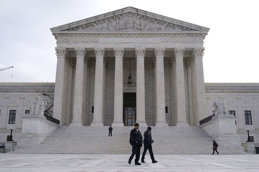 Police officers walk outside the Supreme Court on Capitol Hill in Washington, Tuesday, Feb. 28, 2023, ahead of arguments over President Joe Biden&#x27;s student debt relief plan. (AP Photo/Patrick Semansky) **FILE**