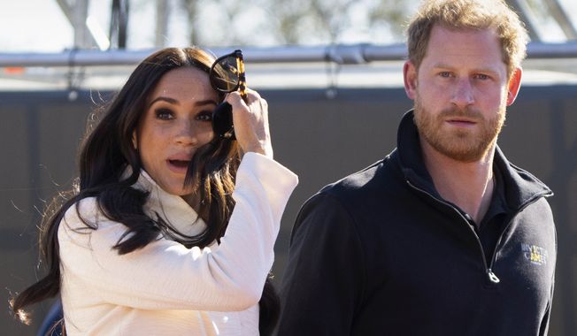 Prince Harry and Meghan Markle, Duke and Duchess of Sussex visit the track and field event at the Invictus Games in The Hague, Netherlands, Sunday, April 17, 2022. Prince Harry and his wife, Meghan, have been asked to vacate their home in Britain. Frogmore Cottage, located on the grounds of Windsor Castle west of London, had been intended as the couple’s main residence before they gave up royal duties and moved to Southern California. (AP Photo/Peter Dejong, File)
