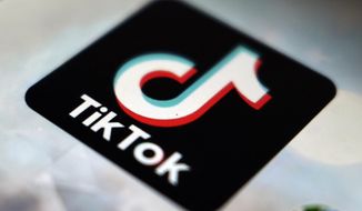 This photo shows a TikTok app logo in Tokyo on Sept. 28, 2020. In the latest salvo in the battle over the Chinese-owned video sharing app, Beijing says a ban on the use of TikTok by official European Union institutions will harm business confidence in Europe. (AP Photo/Kiichiro Sato, File)