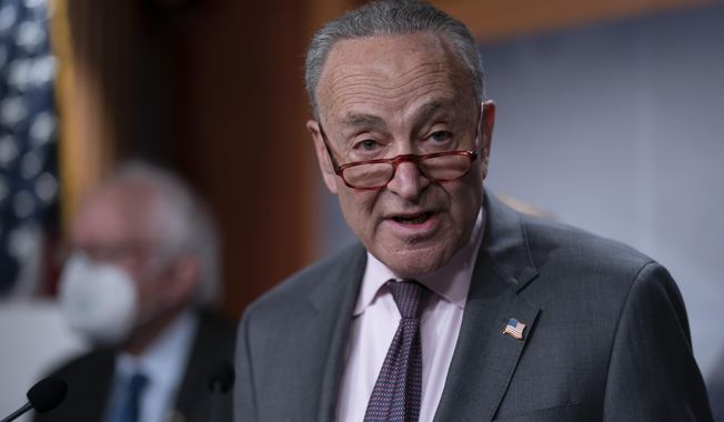 Senate Majority Leader Chuck Schumer, D-N.Y., meets with reporters during a news conference at the Capitol in Washington, Wednesday, March 1, 2023. President Joe Biden will meet with Senate Democrats Thursday to discuss the budget. (AP Photo/J. Scott Applewhite)