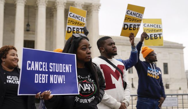 Student debt relief advocates gather outside the Supreme Court on Capitol Hill in Washington, Tuesday, Feb. 28, 2023, as the court hears arguments over President Joe Biden&#x27;s student debt relief plan. (AP Photo/Patrick Semansky)