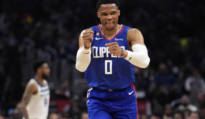 Los Angeles Clippers guard Russell Westbrook (0) celebrates after making a 3-point basket during the first half of an NBA basketball game against the Minnesota Timberwolves Tuesday, Feb. 28, 2023, in Los Angeles. (AP Photo/Marcio Jose Sanchez)
