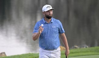 Jon Rahm, of Spain, acknowledges the gallery after making a birdie putt on the 18th green during the first round of the Arnold Palmer Invitational golf tournament, Thursday, March 2, 2023, in Orlando, Fla. (AP Photo/Phelan M. Ebenhack)