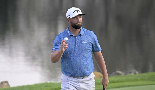 Jon Rahm, of Spain, acknowledges the gallery after making a birdie putt on the 18th green during the first round of the Arnold Palmer Invitational golf tournament, Thursday, March 2, 2023, in Orlando, Fla. (AP Photo/Phelan M. Ebenhack)