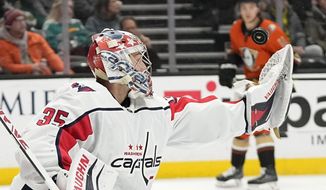 Washington Capitals goaltender Darcy Kuemper deflects a shot during the first period of an NHL hockey game against the Anaheim Ducks Wednesday, March 1, 2023, in Anaheim, Calif. (AP Photo/Mark J. Terrill)