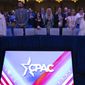 People attending the Conservative Political Action Conference, CPAC 2023, sing the national anthem during the opening session, at the National Harbor, in Oxon Hill, Md., Thursday, March 2, 2023. (AP Photo/Jose Luis Magana)
