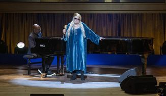 Joni Mitchell performs at the presentation of the Gershwin Prize, which honors a musician&#x27;s lifetime contribution to popular music, hosted at DAR Constitution Hall in Washington on Wednesday, March 1, 2023. She is this year&#x27;s winner. (AP Photo/Amanda Andrade-Rhoades)