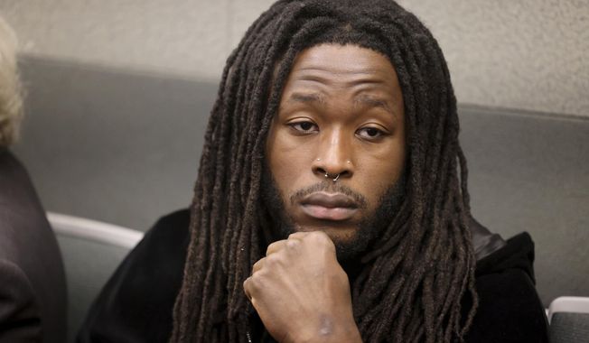 New Orleans Saints running back Alvin Kamara waits for an arraignment at the Regional Justice Center in Las Vegas, Thursday, March 2, 2023. Kamara and three other men pleaded not guilty Thursday in Nevada to charges they beat a man unconscious at a Las Vegas Strip nightclub before the NFL’s 2022 Pro Bowl. (K.M. Cannon/Las Vegas Review-Journal via AP)