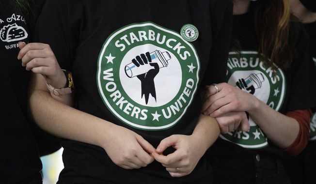 Starbucks employees and supporters react as votes are read during a union-election watch party Dec. 9, 2021, in Buffalo, N.Y. (AP Photo/Joshua Bessex, File)