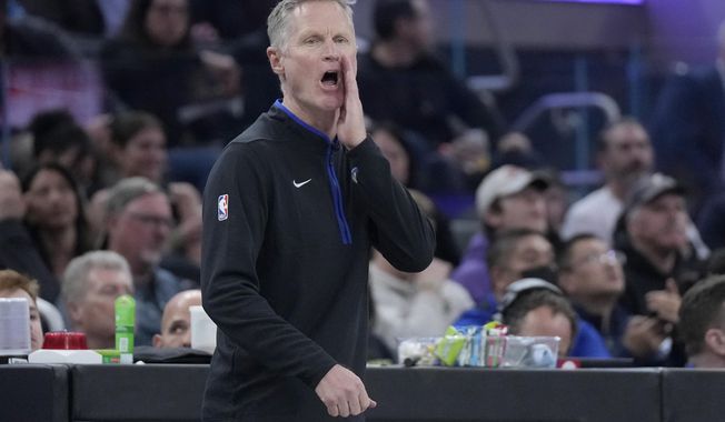 Golden State Warriors head coach Steve Kerr signals toward players during the first half of the team&#x27;s NBA basketball game against the Los Angeles Clippers in San Francisco, Thursday, March 2, 2023. (AP Photo/Jeff Chiu)
