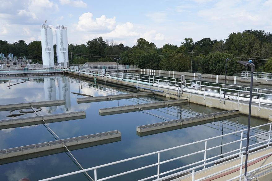 Clouds are reflected off the City of Jackson's O.B. Curtis Water Treatment Facility's sedimentation basins in Ridgeland, Miss., Friday, Sept. 2, 2022. The Biden administration said, Friday, March 3, 2023, it would require states to report on cybersecurity threats in their audits of public water systems, a day after it released a broader plan to protect critical infrastructure against cyberattacks. (AP Photo/Rogelio V. Solis, File)