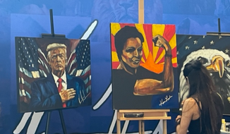Artist Vanessa Horabuena paints a picture of former Arizona gubernatorial candidate Kari Lake at the Conservative Political Action Conference/Credit Seth McLaughlin for The Washington Times