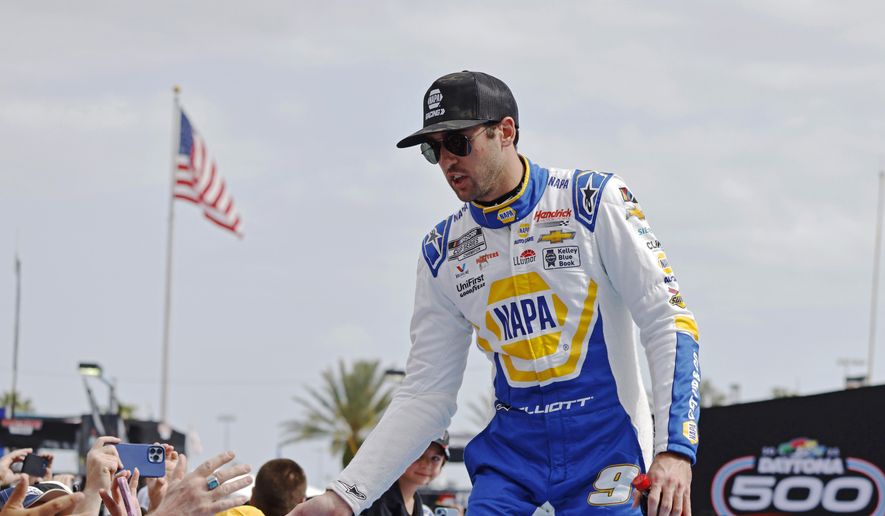 Chase Elliott greets fans during driver introductions before the NASCAR Daytona 500 auto race at Daytona International Speedway on Feb. 19, 2023, in Daytona Beach, Fla. Elliott has injured his leg in a snowboarding accident in Colorado and will miss this weekend’s NASCAR race at Las Vegas. Hendrick Motorsports said NASCAR’s most popular driver was scheduled to have surgery Friday evening. Elliott was injured Friday, March 3. (AP Photo/Terry Renna, File) **FILE**