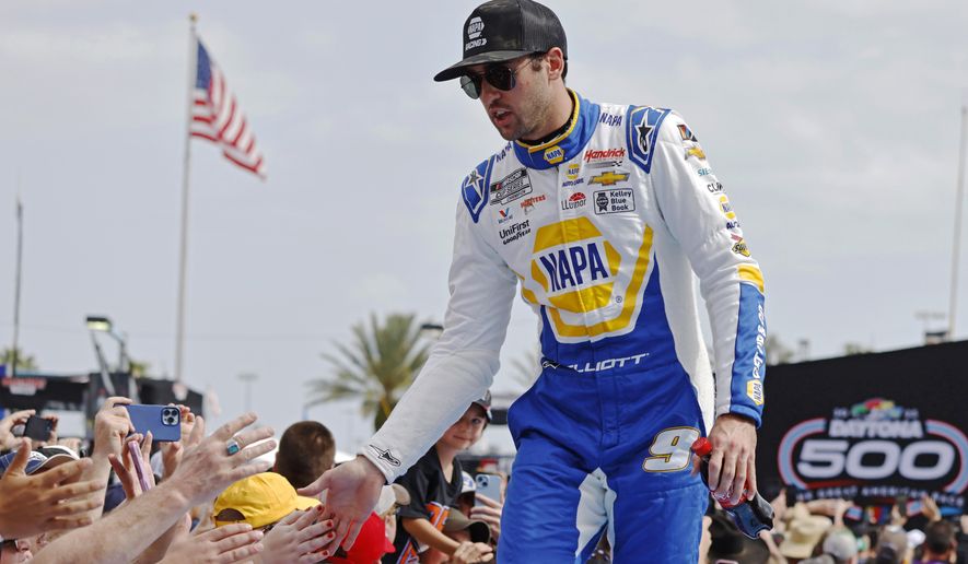 Chase Elliott greets fans during driver introductions before the NASCAR Daytona 500 auto race at Daytona International Speedway on Feb. 19, 2023, in Daytona Beach, Fla. Elliott has injured his leg in a snowboarding accident in Colorado and will miss this weekend’s NASCAR race at Las Vegas. Hendrick Motorsports said NASCAR’s most popular driver was scheduled to have surgery Friday evening. Elliott was injured Friday, March 3. (AP Photo/Terry Renna, File)
