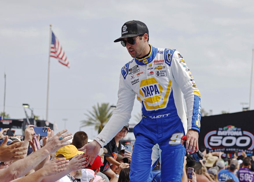 Chase Elliott greets fans during driver introductions before the NASCAR Daytona 500 auto race at Daytona International Speedway on Feb. 19, 2023, in Daytona Beach, Fla. Elliott has injured his leg in a snowboarding accident in Colorado and will miss this weekend’s NASCAR race at Las Vegas. Hendrick Motorsports said NASCAR’s most popular driver was scheduled to have surgery Friday evening. Elliott was injured Friday, March 3. (AP Photo/Terry Renna, File) **FILE**