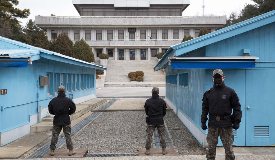 South Korean soldiers stand guard during a media tour at the Joint Security Area (JSA) on the Demilitarized Zone (DMZ) in the border village of Panmunjom in Paju, South Korea, on Friday, March 3, 2023. (Jeon Heon-Kyun/Pool Photo via AP) ** FILE **