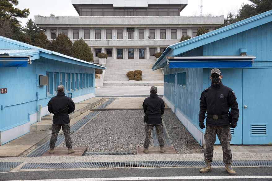 South Korean soldiers stand guard during a media tour at the Joint Security Area (JSA) on the Demilitarized Zone (DMZ) in the border village of Panmunjom in Paju, South Korea, on Friday, March 3, 2023. (Jeon Heon-Kyun/Pool Photo via AP) ** FILE **