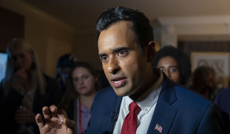 Vivek Ramaswamy speaks with the Associated Press with supporters nearby, at the Conservative Political Action Conference, CPAC 2023, Friday, March 3, 2023, at National Harbor in Oxon Hill, Md. (AP Photo/Alex Brandon)