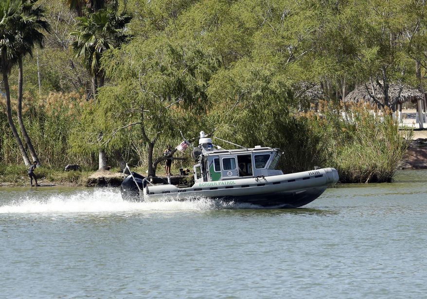 U.S. Border Patrol agents patrol the Rio Grande by boat near the Mexican side of the river near Anzalduas Park, Friday, March 3, 2023, in Mission, Texas. (Joel Martinez/The Monitor via AP)