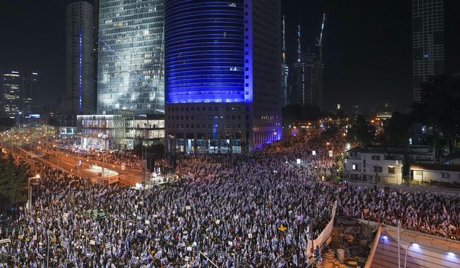 Tens of thousands of Israelis protest against plans by Prime Minister Benjamin Netanyahu&#x27;s new government to overhaul the judicial system, in Tel Aviv, Israel, Saturday, March 4, 2023. (AP Photo/Tsafrir Abayov)