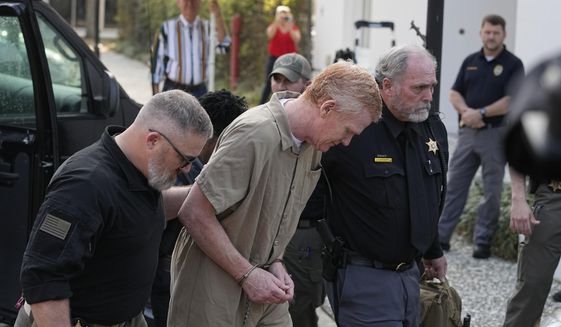 Alex Murdaugh is led to the Colleton County Courthouse by sheriff&#x27;s deputies for sentencing in in Walterboro, S.C., Friday, March 3, 2023, after being convicted of two counts of murder in the June 7, 2021, shooting deaths of his wife and son. (AP Photo/Chris Carlson)