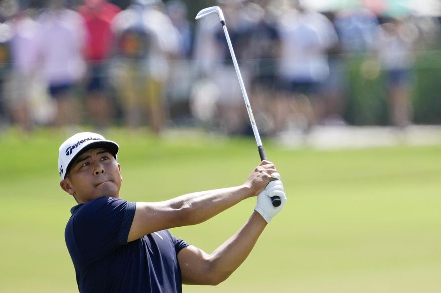 Kurt Kitayama watches his shot on the first fairway during final round of the Arnold Palmer Invitational golf tournament Sunday, March 5, 2023, in Orlando, Fla. (AP Photo/John Raoux)