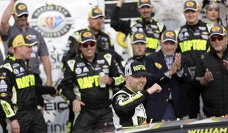 William Byron (24) celebrates with his team after winning a NASCAR Cup Series auto race on Sunday, March 5, 2023, in Las Vegas. (AP Photo/Ellen Schmidt) **FILE**