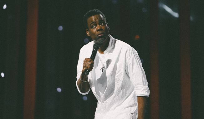 This image released by Netflix shows Chris Rock during a performance his comedy special &quot;Chris Rock: Selective Outrage&quot; at the Hippodrome Theater in Baltimore, Md. (Kirill Bichutsky/Netflix via AP)