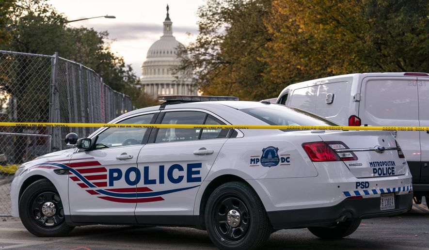 Washington Metropolitan Police investigate near the Supreme Court and Capitol after reports of a suspicious vehicle in which two men and a woman were detained with guns, in Washington, Oct. 19, 2022. The head of the D.C. Council said Monday, March 6, 2023, that he is withdrawing the capital city’s new criminal code from consideration, just before a U.S. Senate vote that seemed likely to overturn the measure. But it&#x27;s unclear if the action will prevent the vote or spare President Joe Biden a politically charged decision on whether to endorse the congressional action. (AP Photo/J. Scott Applewhite, File)