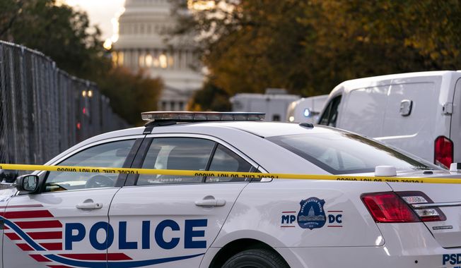 Washington Metropolitan Police investigate near the Supreme Court and Capitol after reports of a suspicious vehicle in which two men and a woman were detained with guns, in Washington, Oct. 19, 2022. The head of the D.C. Council said Monday, March 6, 2023, that he is withdrawing the capital city鈥檚 new criminal code from consideration, just before a U.S. Senate vote that seemed likely to overturn the measure. But it&#x27;s unclear if the action will prevent the vote or spare President Joe Biden a politically charged decision on whether to endorse the congressional action. (AP Photo/J. Scott Applewhite, File)