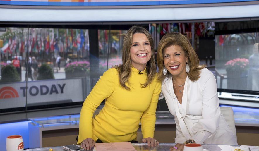 Co-anchors Savannah Guthrie, left, and Hoda Kotb pose on the &quot;Today&quot; show set at NBC Studios on June 27, 2018, in New York. On Wednesday NBC addressed the mystery of Kotb&#x27;s absence on the program. Kotb, who has been absent from the morning show last week and this week, is dealing with an unspecified “family health matter.&quot; Guthrie, who left midshow on Tuesday, tested positive for COVID. (Photo by Charles Sykes/Invision/AP, File)