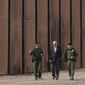 President Joe Biden walks with U.S. Border Patrol agents along a stretch of the U.S.-Mexico border in El Paso Texas, Sunday, Jan. 8, 2023. A new poll by The Associated Press-NORC Center for Public Affairs Research shows some support for changing the number of immigrants and asylum-seekers allowed into the country. About 4 in 10 U.S. adults say the level of immigration and asylum-seekers should be lowered, while about 2 in 10 say they should be higher, according to the poll. About a third want the numbers to remain the same. (AP Photo/Andrew Harnik)