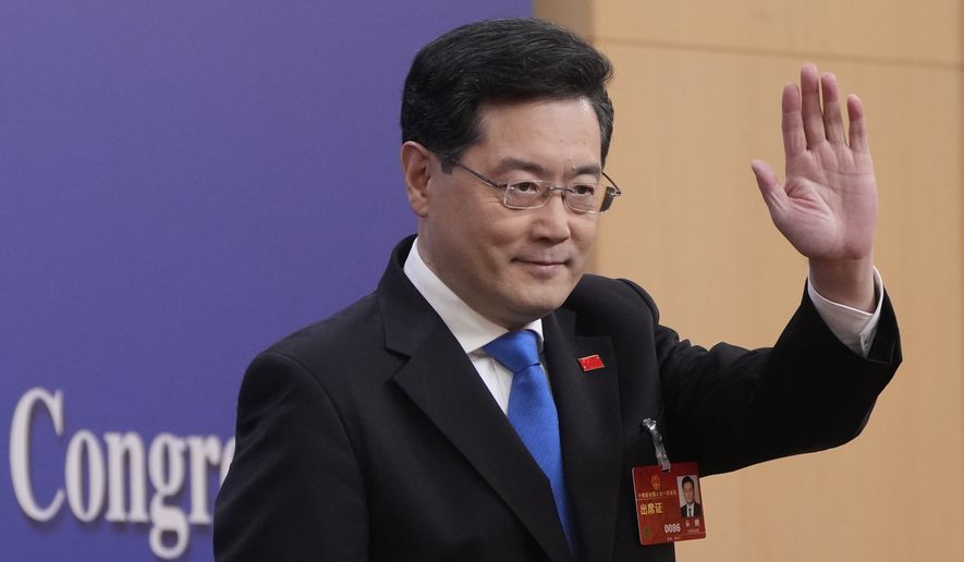 Chinese Foreign Minister Qin Gang waves as he arrives for a press conference held on the sidelines of the annual meeting of China&#x27;s National People&#x27;s Congress (NPC) in Beijing, Tuesday, March 7, 2023. (AP Photo/Mark Schiefelbein)