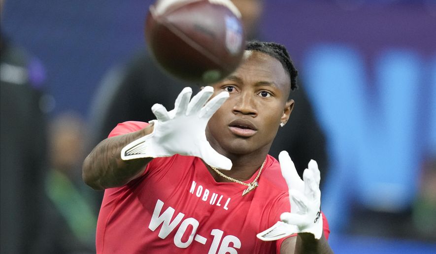 Boston College wide receiver Zay Flowers runs a drill at the NFL football scouting combine in Indianapolis, Saturday, March 4, 2023. (AP Photo/Michael Conroy)