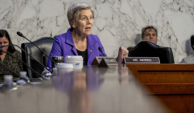 Sen. Elizabeth Warren, D-Mass., speaks as Federal Reserve Chairman Jerome Powell testifies during a Senate Banking Committee hearing on Capitol Hill in Washington, Tuesday, March 7, 2023. (AP Photo/Andrew Harnik)