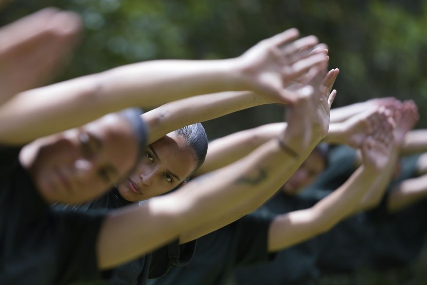 Female voluntary recruits attend a three month training program at a military base in Bogota, Colombia, Monday, March 6, 2023. After a 25-year ban, the Colombian army is once again allowing women to join its ranks through voluntary military service, which is a requirement for men. (AP Photo/Fernando Vergara)