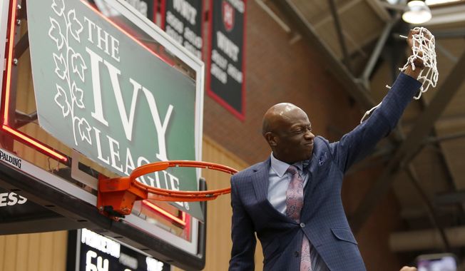 Yale head coach James Jones celebrates after cutting down the net after defeating Princeton in the NCAA Ivy League men&#x27;s college basketball championship game, Sunday, March 13, 2022, in Cambridge, Mass.A federal lawsuit filed by a pair of basketball players from Brown University alleges the Ivy League’s policy of not offering athletic scholarships amounts to a price-fixing agreement that denies athletes proper financial aid and payment for their services. The lawsuit was filed Tuesday, March 7, 2023, in U.S. District Court in Connecticut. (AP Photo/Mary Schwalm, File)