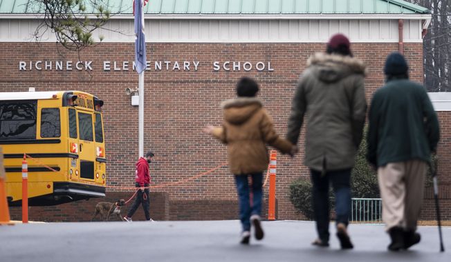 Students return to Richneck Elementary in Newport News, Va., Jan. 30, 2023. Authorities in the Virginia city where a 6-year-old shot and wounded his teacher will not seek charges against the child, the local prosecutor told NBC News on Wednesday, March 8. (Billy Schuerman/The Virginian-Pilot via AP, File)