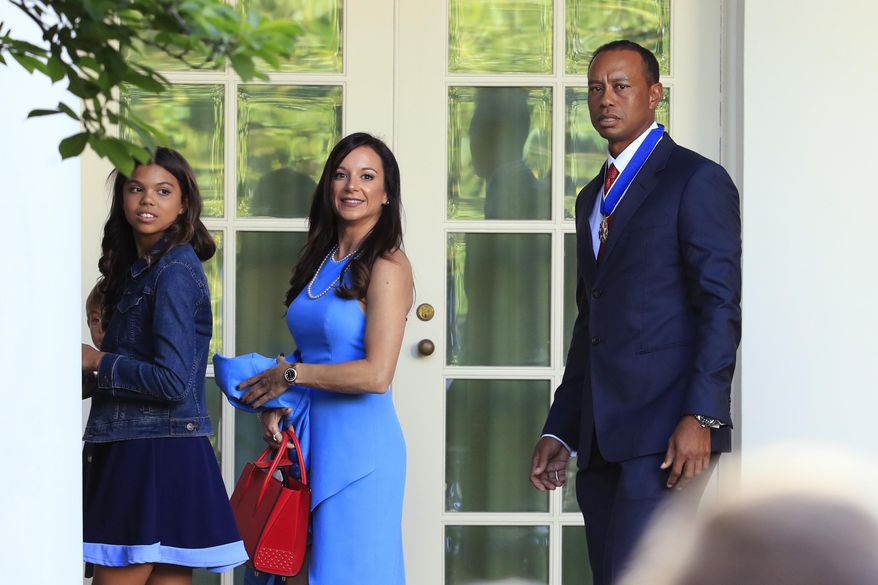 Tiger Woods, right, with his daughter Sam Alexis Woods, left, and his girlfriend Erica Herman, center, walk along the Colonnade following a ceremony where President Donald Trump awarded the Presidential Medal of Freedom to Tiger Woods at the White House in Washington, on May 6, 2019. Herman wants to nullify a nondisclosure agreement following a six-year relationship with the professional golfer, according to court records Monday, March 6, 2023. (AP Photo/Manuel Balce Ceneta, File) **FILE**
