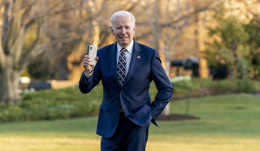 President Joe Biden boards waves as he arrives back to the White House in Washington, Thursday, March 9, 2023, after traveling to Philadelphia. (AP Photo/Andrew Harnik)
